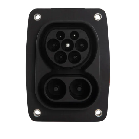 Close-up van een 🇳🇱 CCS2 stopcontact voor auto | 150A DC | 32A AC op een zwart laadinlaat, met zeven ronde connectoren en vier bevestigingsschroeven-perfect voor DC snelladen.