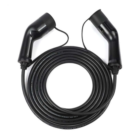 Een zwarte Laadkabel voor laadpaal type 2 3-fase 32A 22kW voor elektrische auto, opgerold met connectoren naar binnen, is ideaal voor het efficiënt opladen van elektrische voertuigen tot 22 kW.